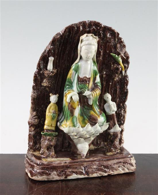 A Chinese Sancai glazed biscuit shrine of Guanyin, Kangxi period, 20.5cm